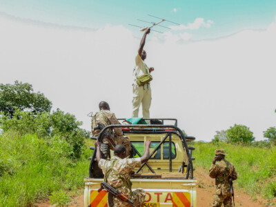 Innocent Komakech - the UCF Projects officer KVNP working together with UWA rangers - searching for lions in Kidepo Valley National Park