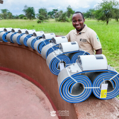 Dr Crispus Singoma with elephant collars_KVCA