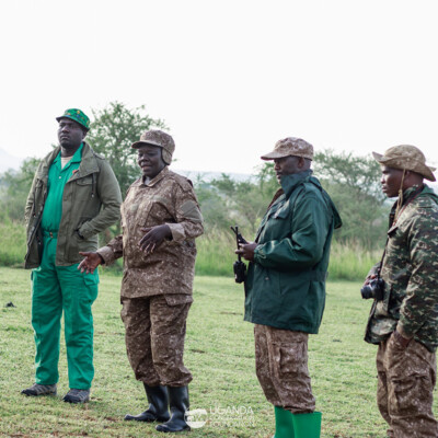 Innocent Komakech - a UCF KVCA officer having a conversation with Dr Margret and UWA Rangers during the elephant collaring exercise